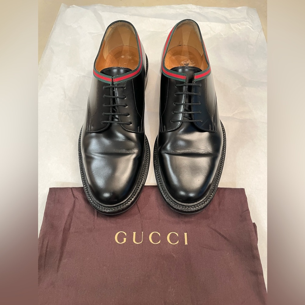 Gucci black shiny leather lace ups.